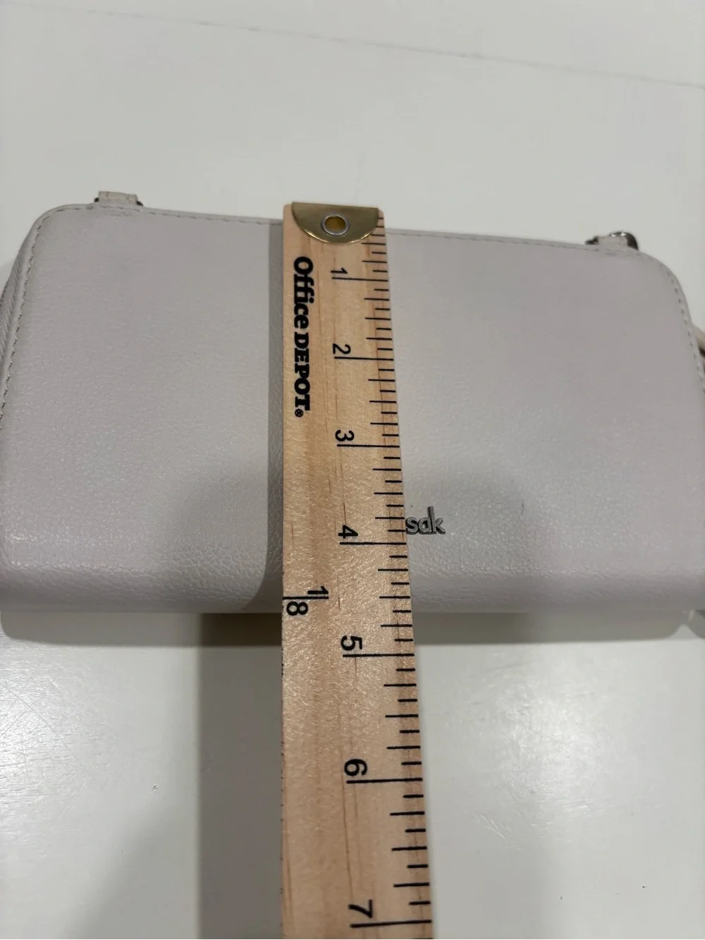 The Sak Light Cream Wristlet Clutch